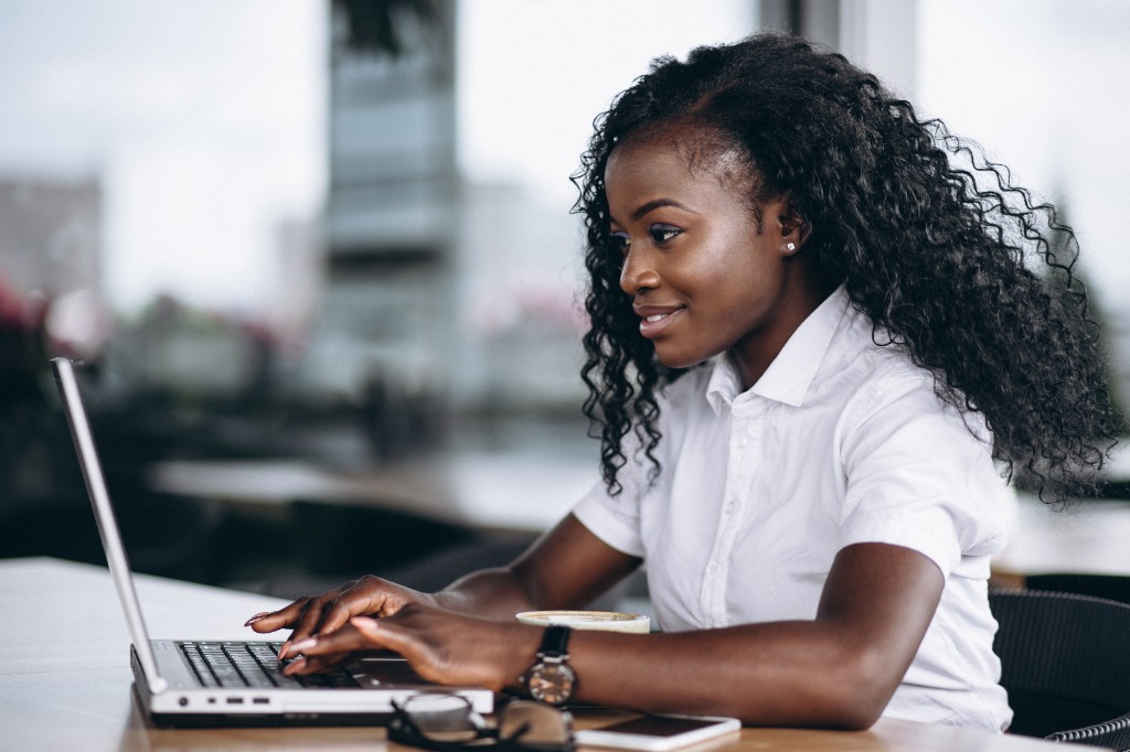 Business Executive reviewing live automated revenue analytics on laptop